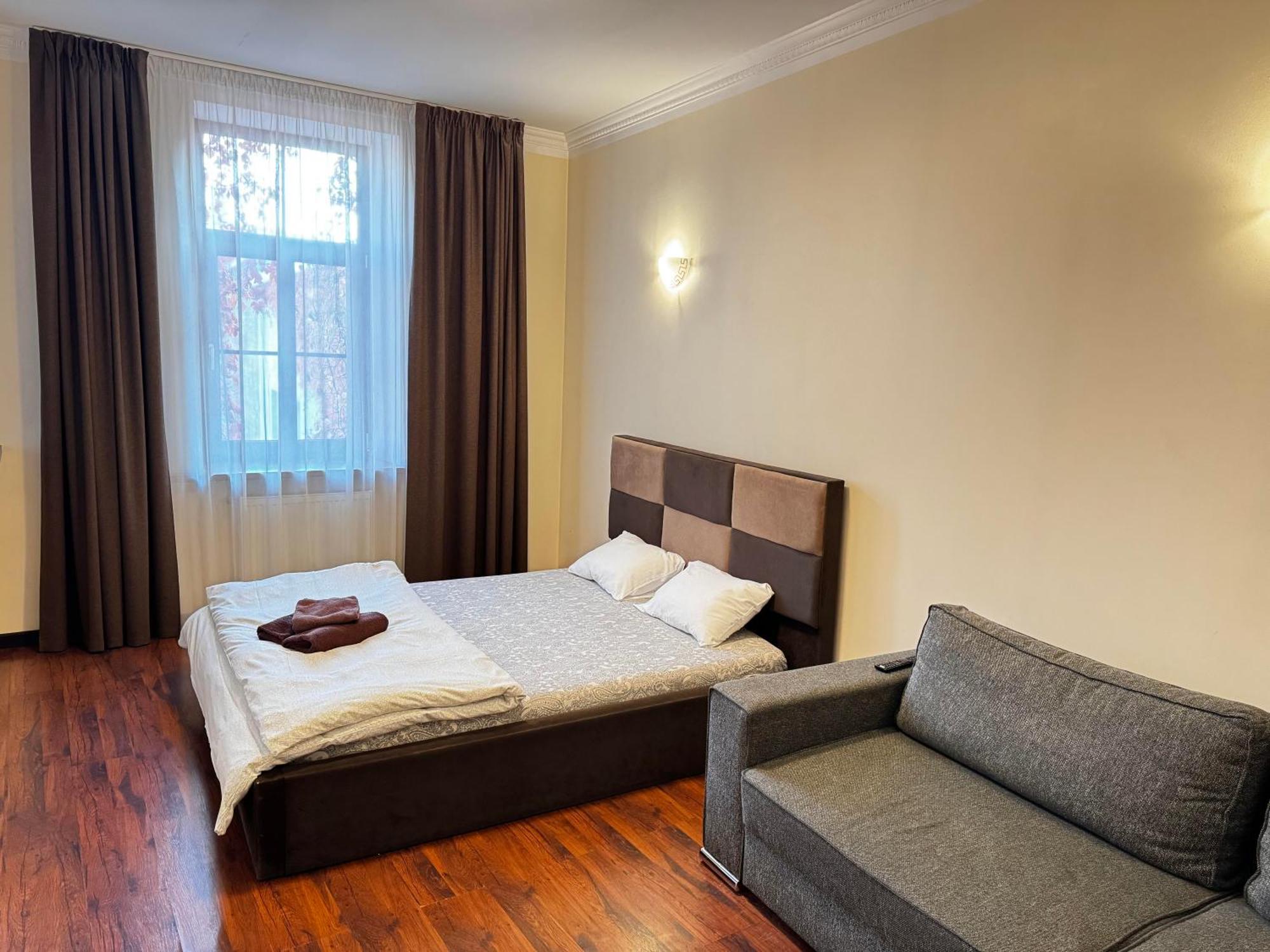 Aparthotel ריגה מראה חיצוני תמונה A bedroom in a hotel